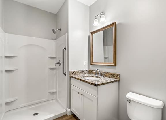 Ashland Woods apartments bathroom with bright finishes, granite