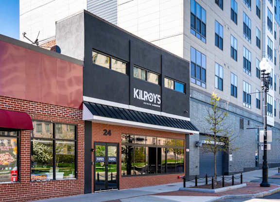 A Kilroy's storefront is shown with a red awning and a black sign.