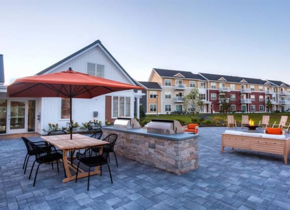 Redbrook plymouth leasing center, apartments, grills and firepits.