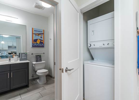A white oven is in a kitchen next to a toilet at the Mastlight.