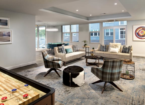 a resident clubhouse with a foosball table and pool table