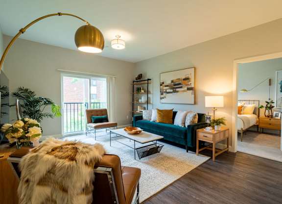Another living room setup with natural tones, a floor lamp, and decor that seamlessly blends luxury and comfort.