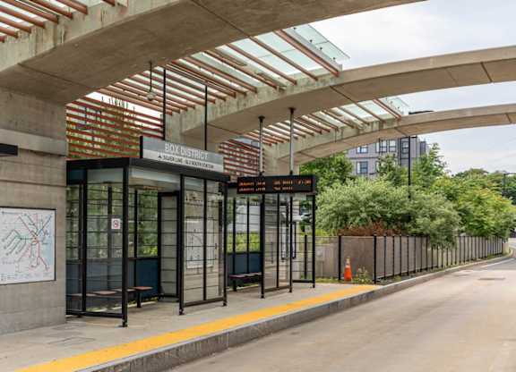 A bus stop with a sign that reads