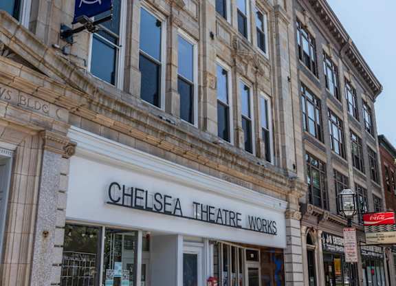 A building with a sign that says Chelsea Theatre Works.
