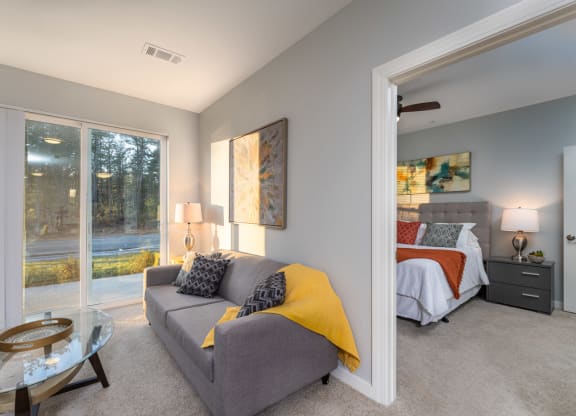 Redbrook two bedroom model apartment living space and patio