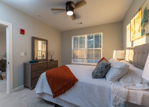 redbrook modle apartment bedroom with ceiling fan and large windows