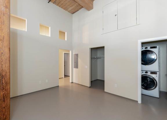 A laundry room with a washer and dryer in it.