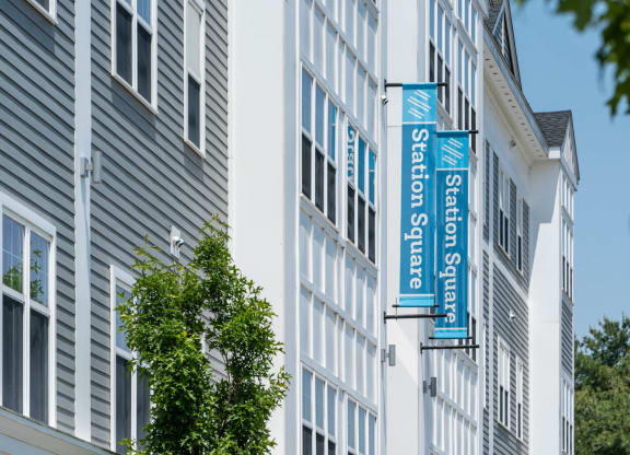 a picture of a building with a blue and white sign on the side of it