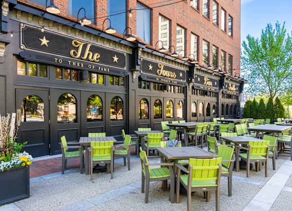 The restaurant has tables and chairs outside.