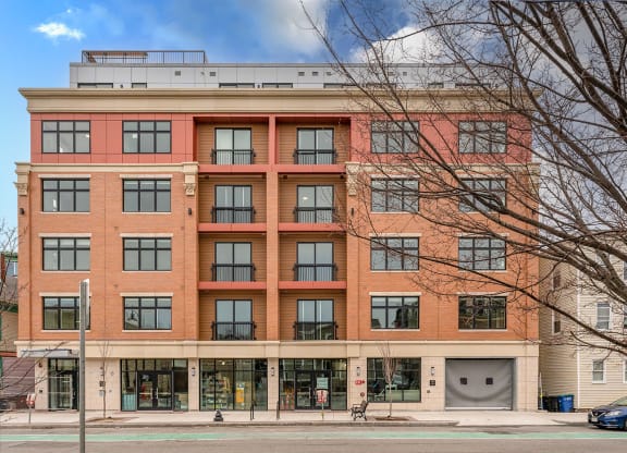 a large brick building with a parking garage in front of it at Union 346, Somerville, MA