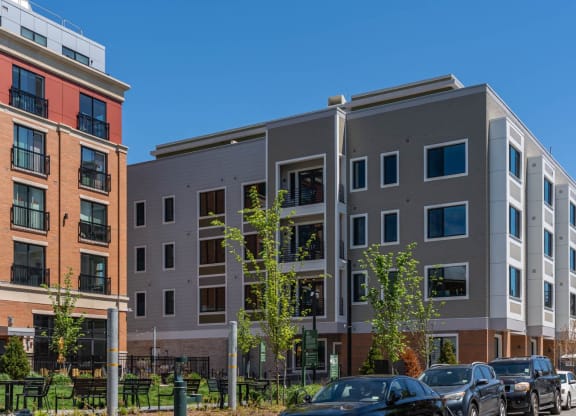 a new apartment building with cars parked in front of it  at Union 346, Somerville, MA 02143