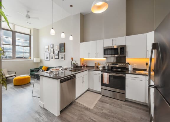 a kitchen with stainless steel appliances and a counter top
