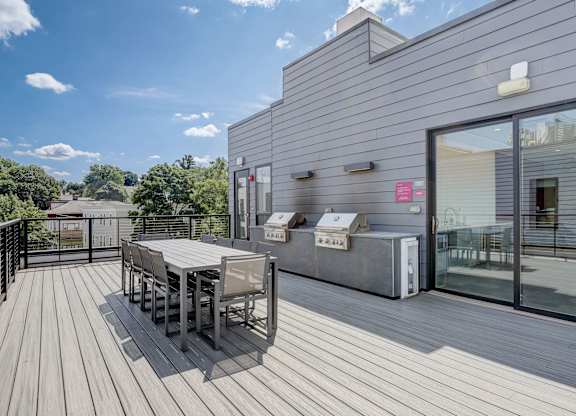 Roof deck with table and grilling space