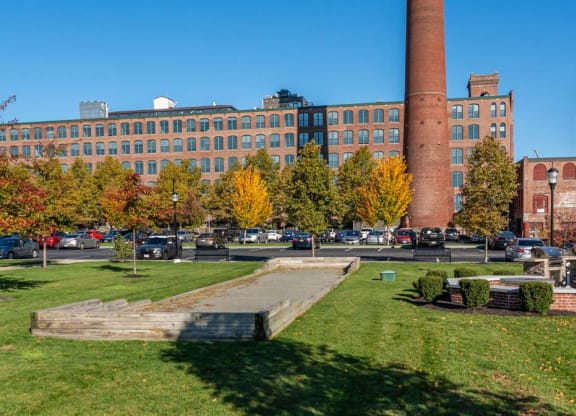 a view of the courtyard with bocce and the Mill's smokestack