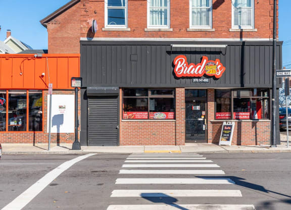 Brad's pizza restaurant on the corner of a street in Downtown Lawrence