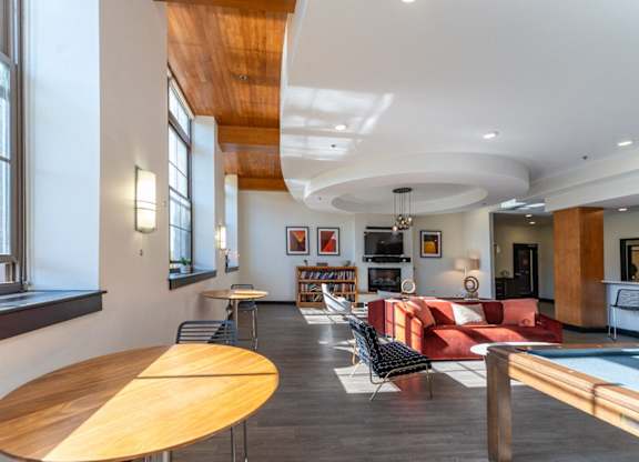 Community lounge at Washington Mill 240 with a pool table, business center, kitchen, fireplace