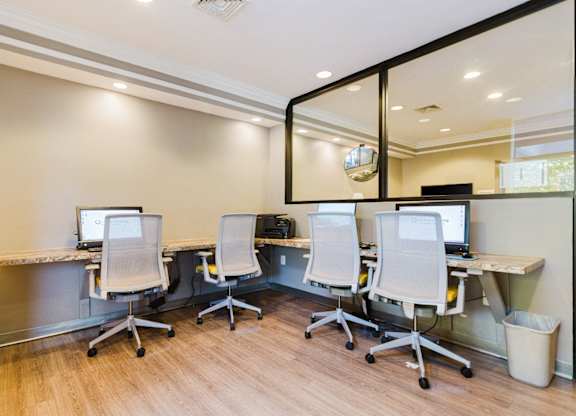 A room with a desk and four chairs at Branchwood Towers, Clinton
