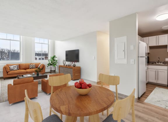 a living room and dining room with a table and chairs at Chapman House, E. Boston, MA
