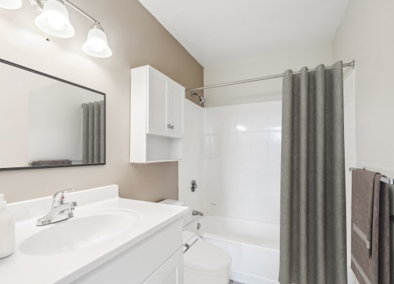 a bathroom with a white sink and a shower at Chapman House, E. Boston, MA, 02128