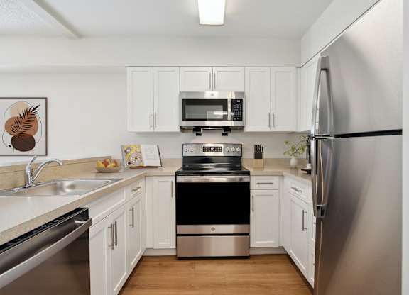 Kitchen Layout With Stainless Steel Appliances, White Cabinetry, Open Layout. Mariners Hill, Marshfield, MA.