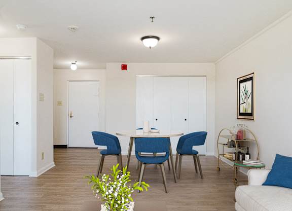 A dining area with a table and chairs at Branchwood Towers, Clinton