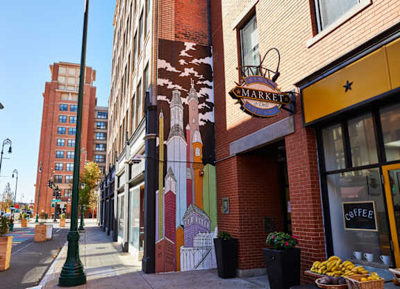 a mural on the side of a building on a city street at Ninth Square Apartments, New Haven, 06510