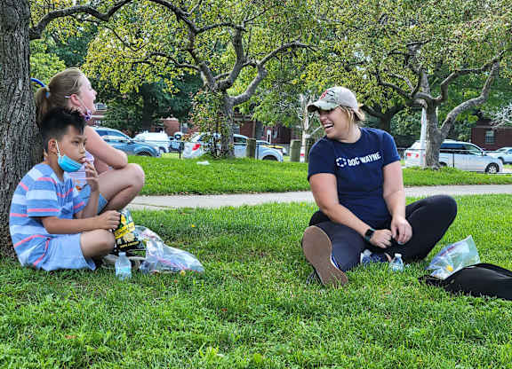 Children Playing Outside With Staff Tierney Learning Center.