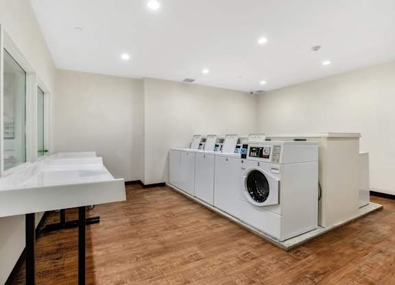 A laundry room with a washer and dryer at Brewery Square Apartments, New Haven  06513