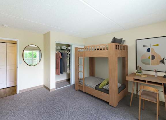a bunk bed in a room with a desk and a mirror at North Stoughton Village, Massachusetts, 02072