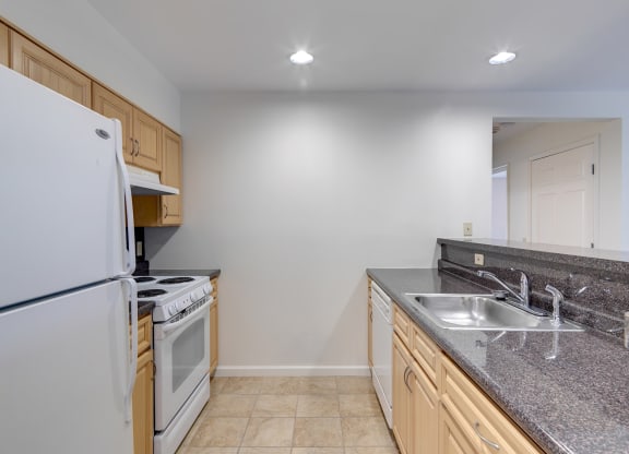 Kitchen Layout With White Appliances View From Livingroom at The Birches at Chambers, New York