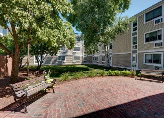 Courtyard with Bench  at Blake Estates Apartments in Hyde Park, Massachusetts
