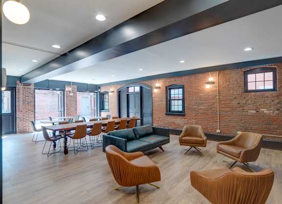 Community room with table and chairs at Ninth Square Apartments. at Ninth Square Apartments, New Haven