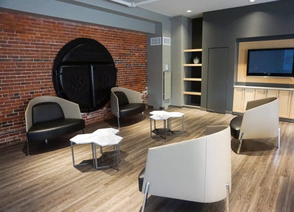 Community Clubroom with TV and Sitting Area. at Haverhill Lofts, Massachusetts