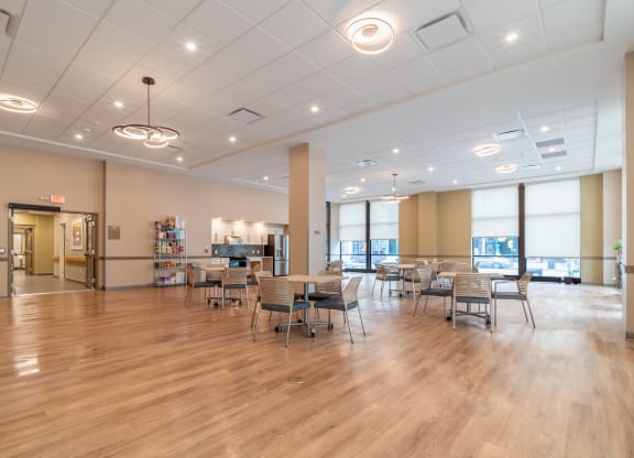 Community Room with tables and chairs at Richford Arms Apartments, Erie Pennsylvania