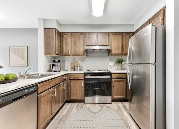 Kitchen With Wooden Cabinets And Stainless Steel Appliances at Niagara Square, New York, 14201