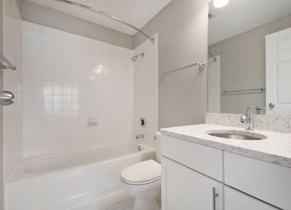 the preserve at ballantyne commons apartment bathroom with tub sink and toilet