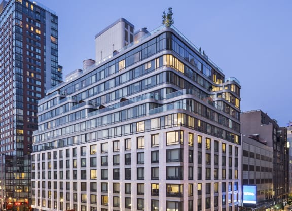 a rendering of a large building in a city at night
