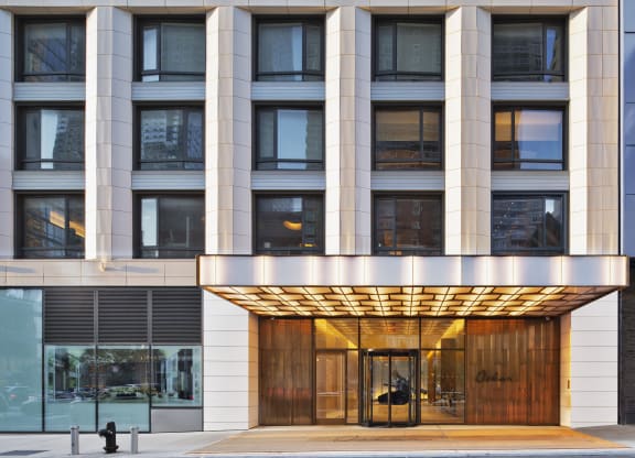the entrance to a building with a wood revolving door
