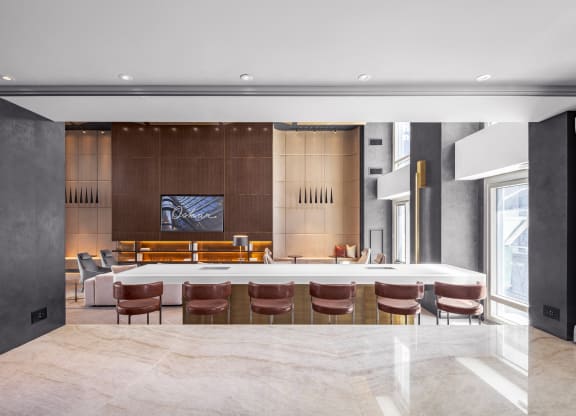 a large room with a table and chairs in the middle of it