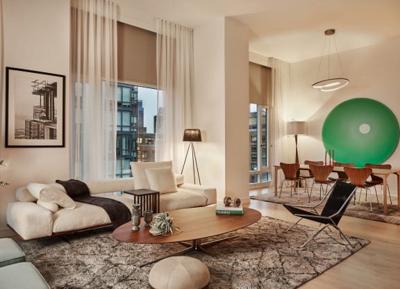 a living room with a green ball on the wall and a couch