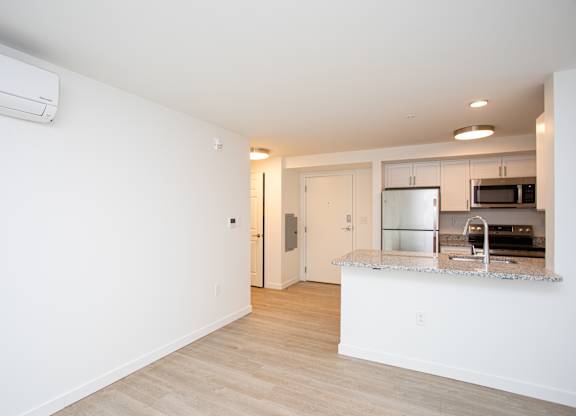 A kitchen with a counter and a microwave.at The Camelot, Connecticut, 06119