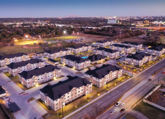 an aerial view of a neighborhood at night at 55 Fifty at Northwest Crossing, Texas, 77092