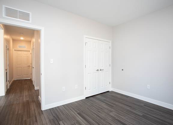 A room with a white door and a white wall at MLK Apartments, Hartford, 06106
