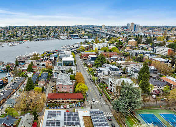 an aerial view of a city with buildings and trees