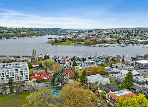 an aerial view of a city and a body of water