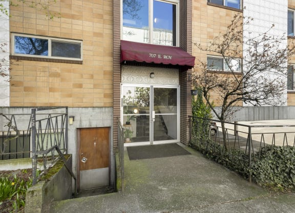 the entrance to a building with a wooden door