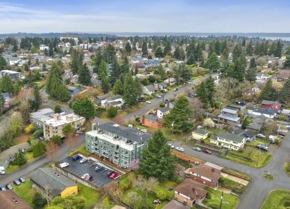an aerial view of a city with trees and buildings
