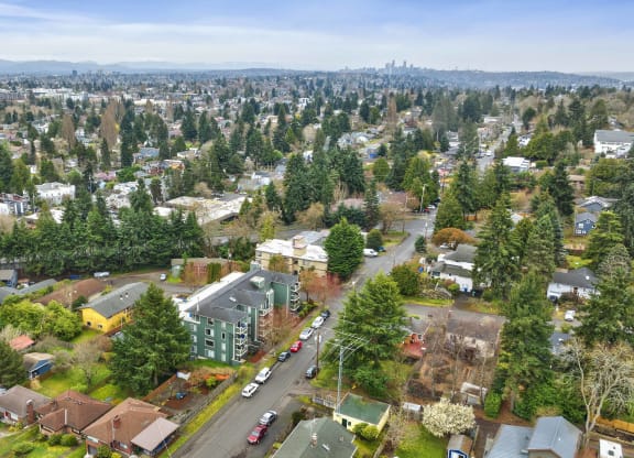 an aerial view of a city with houses and trees