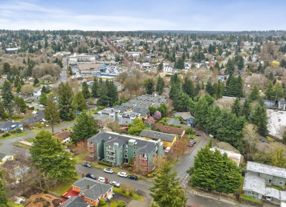 an aerial view of a city with houses and trees