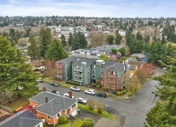 an aerial view of a city with buildings and trees